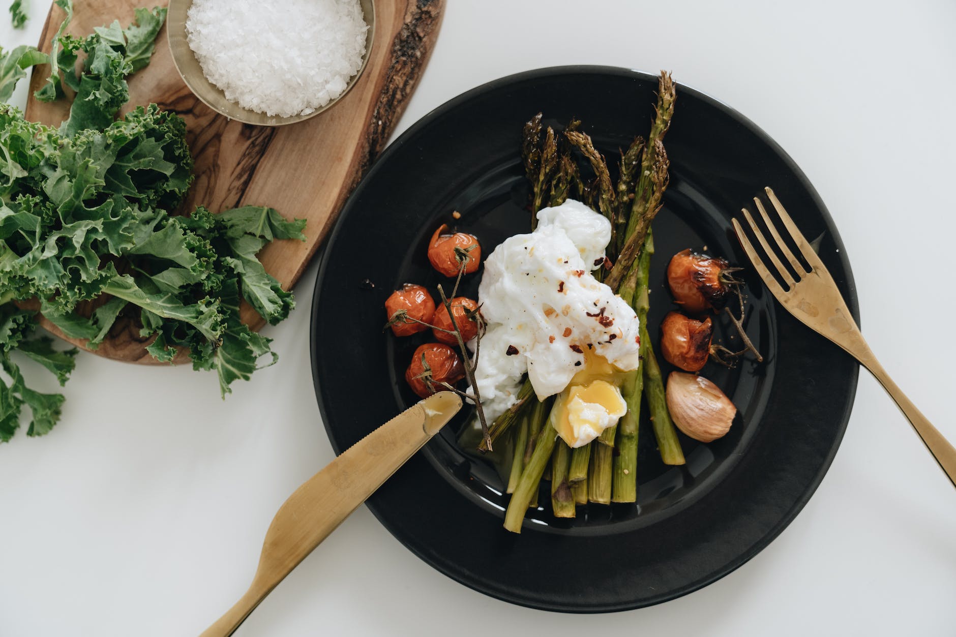 photo of poached egg on top of asparagus